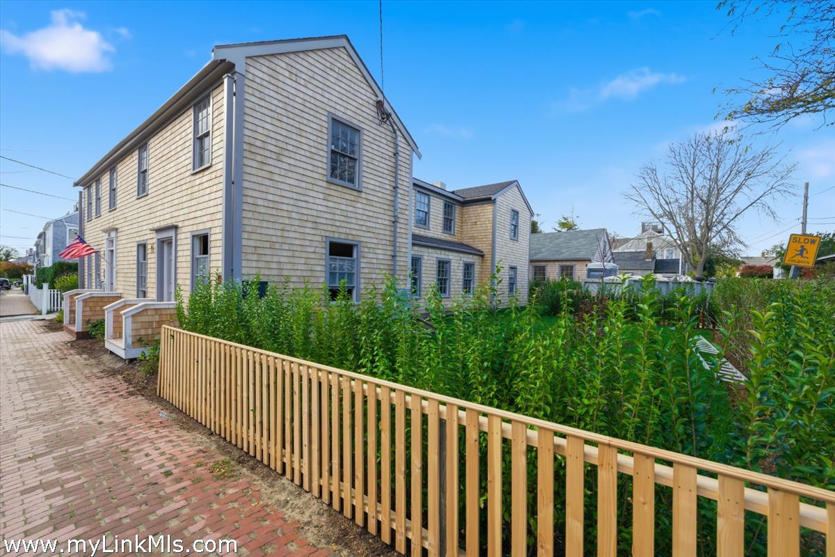 85 Orange Street Nantucket, MA 02554 - Photo 8 of 89 a view of a house with backyard and sitting area