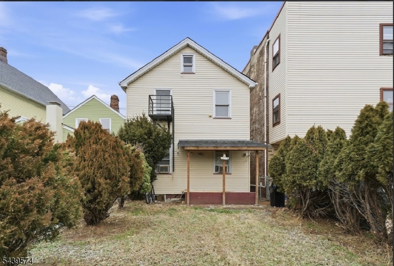 328 John Street Elizabeth, NJ 07202 - Photo 9 of 9 a front view of a house with a yard and garage