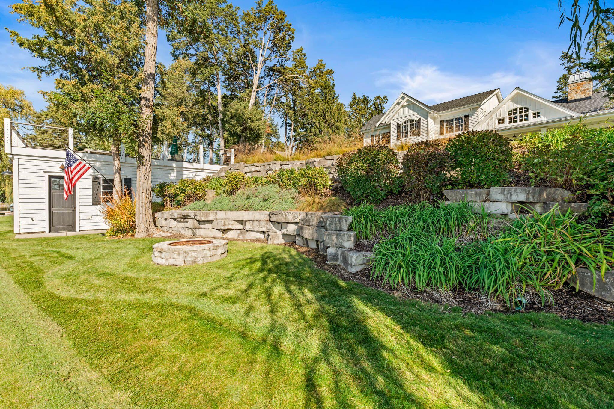 3005 North Silver Cedar Road Summit, WI 53066 - Photo 26 of 28 Perennial gardens and lakeside firepit