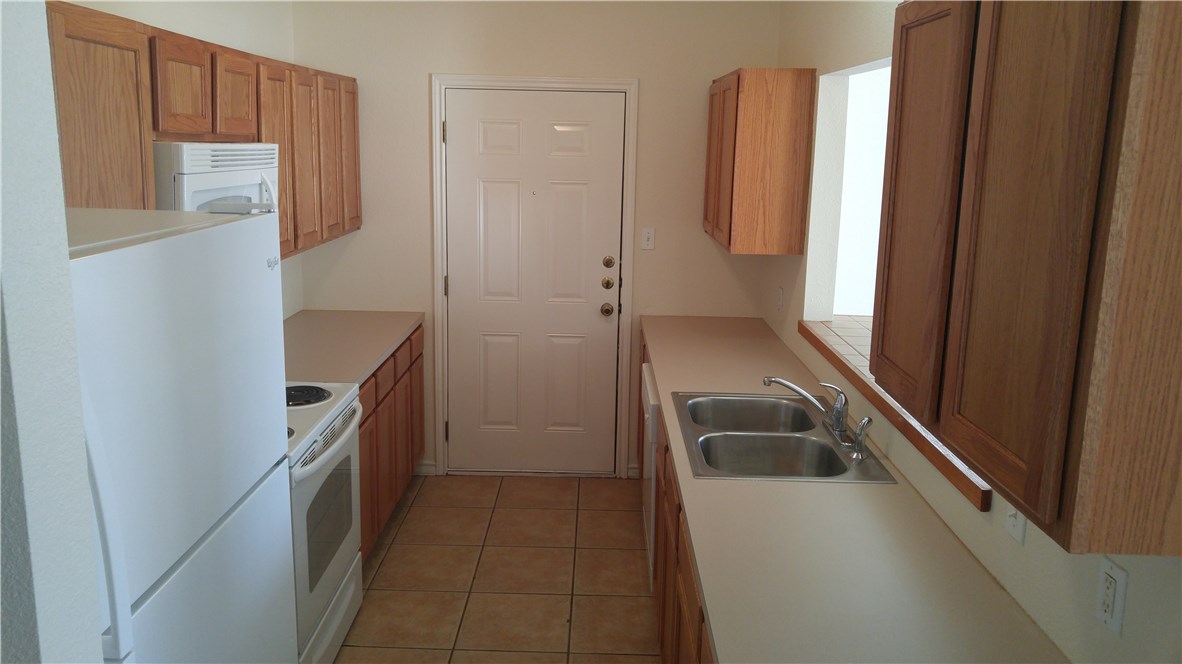 118 Sandstone Drive, Unit A Jarrell, TX 76537 - Photo 5 of 6 a bathroom with a sink a toilet and shower