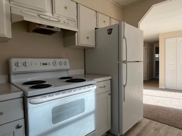 223 Yarbrough Road St. Augustine, FL 32095 - Photo 7 of 16 a kitchen with stainless steel appliances white cabinets and a refrigerator