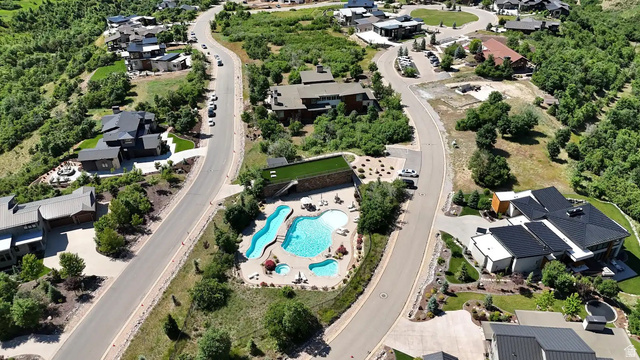 70 West Cougar Run Salem, UT 84653 - Photo 1 of 7 Community amenities featuring a multi-pool aquatic area with a water slide, integrated hot tub, and surrounding lounge space