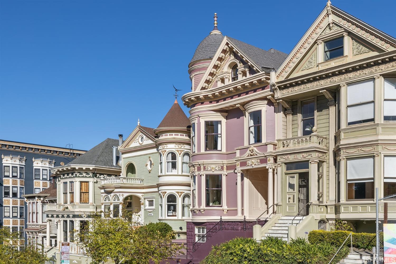818 Steiner Street San Francisco, CA 94117 - Photo 2 of 74 Lower level is complete with a separate au pair or guest quarters that includes a bedroom/lounge and a full-bath which can be accessed separately though the home’s side entrance. Down the hall are a home gym & full-bathroom, a wine room, spacious laundry and utility areas, and a room with built-in storage that leads to the outdoor spa area with rain shower and cedar hot tub. There’s never been a better yard for entertaining; built-in seating, a roaring fire pit, and a concrete slide in its lower-level turf-lawn play space. This home offers a lifestyle surrounded by the beauty of Alamo Square Park, the vibrancy of Hayes Valley and Divisadero Corridor, and a clear connection to San Francisco’s downtown and beyond. 