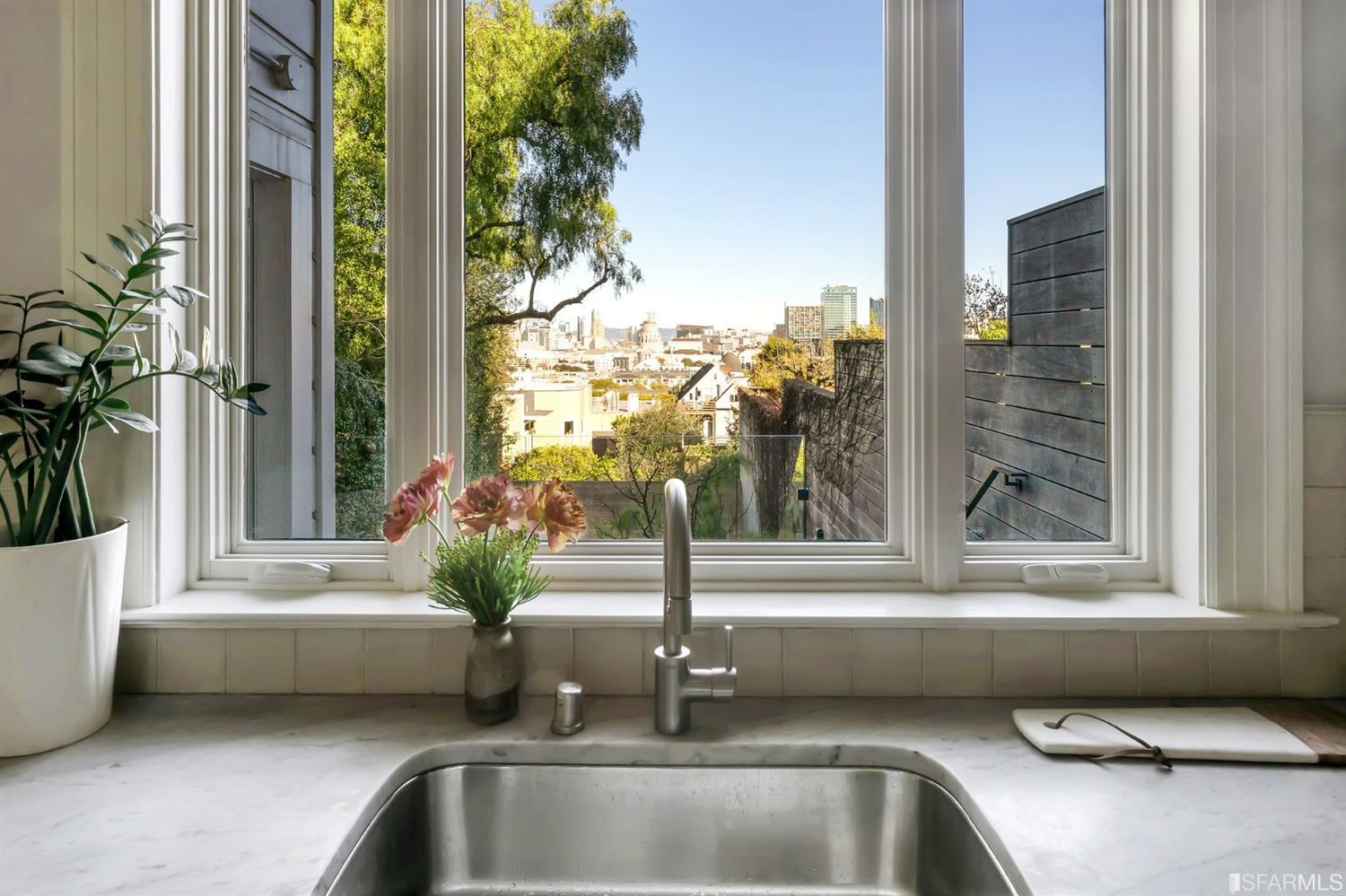 818 Steiner Street San Francisco, CA 94117 - Photo 15 of 74 Lower level is complete with a separate au pair or guest quarters that includes a bedroom/lounge and a full-bath which can be accessed separately though the home’s side entrance. Down the hall are a home gym & full-bathroom, a wine room, spacious laundry and utility areas, and a room with built-in storage that leads to the outdoor spa area with rain shower and cedar hot tub. There’s never been a better yard for entertaining; built-in seating, a roaring fire pit, and a concrete slide in its lower-level turf-lawn play space. This home offers a lifestyle surrounded by the beauty of Alamo Square Park, the vibrancy of Hayes Valley and Divisadero Corridor, and a clear connection to San Francisco’s downtown and beyond. 