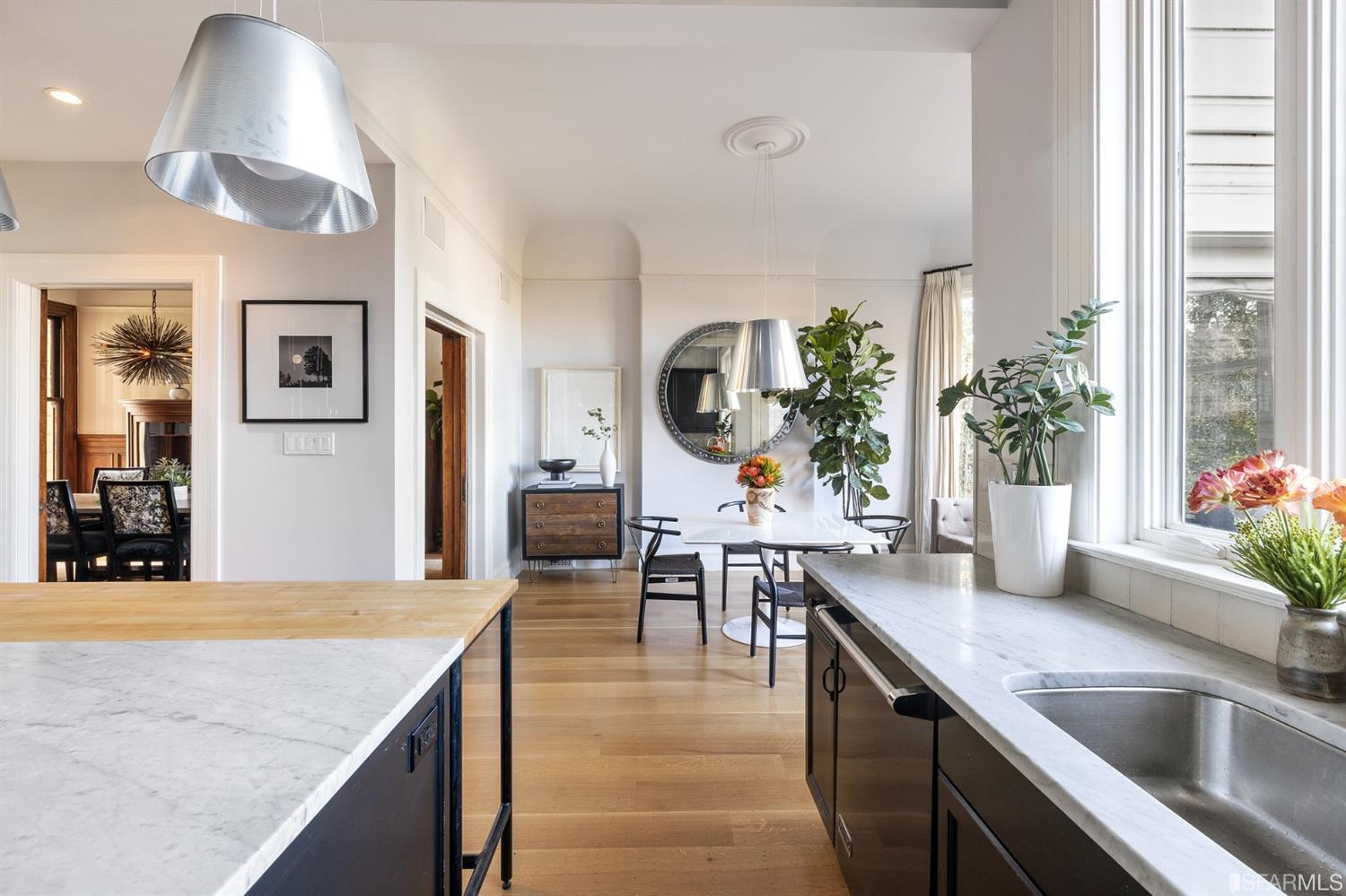 818 Steiner Street San Francisco, CA 94117 - Photo 16 of 74 Lower level is complete with a separate au pair or guest quarters that includes a bedroom/lounge and a full-bath which can be accessed separately though the home’s side entrance. Down the hall are a home gym & full-bathroom, a wine room, spacious laundry and utility areas, and a room with built-in storage that leads to the outdoor spa area with rain shower and cedar hot tub. There’s never been a better yard for entertaining; built-in seating, a roaring fire pit, and a concrete slide in its lower-level turf-lawn play space. This home offers a lifestyle surrounded by the beauty of Alamo Square Park, the vibrancy of Hayes Valley and Divisadero Corridor, and a clear connection to San Francisco’s downtown and beyond. 