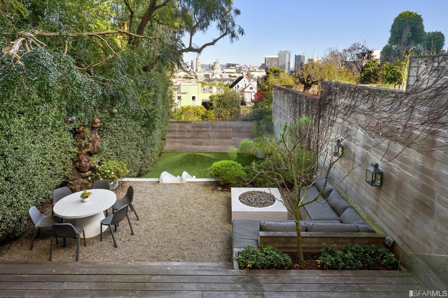 818 Steiner Street San Francisco, CA 94117 - Photo 18 of 74 Lower level is complete with a separate au pair or guest quarters that includes a bedroom/lounge and a full-bath which can be accessed separately though the home’s side entrance. Down the hall are a home gym & full-bathroom, a wine room, spacious laundry and utility areas, and a room with built-in storage that leads to the outdoor spa area with rain shower and cedar hot tub. There’s never been a better yard for entertaining; built-in seating, a roaring fire pit, and a concrete slide in its lower-level turf-lawn play space. This home offers a lifestyle surrounded by the beauty of Alamo Square Park, the vibrancy of Hayes Valley and Divisadero Corridor, and a clear connection to San Francisco’s downtown and beyond. 