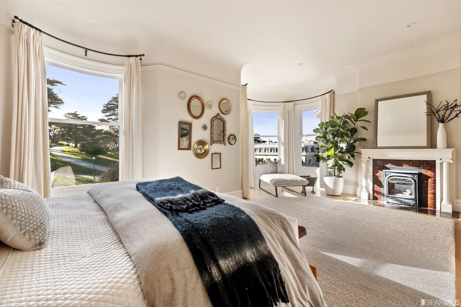 818 Steiner Street San Francisco, CA 94117 - Photo 22 of 74 Lower level is complete with a separate au pair or guest quarters that includes a bedroom/lounge and a full-bath which can be accessed separately though the home’s side entrance. Down the hall are a home gym & full-bathroom, a wine room, spacious laundry and utility areas, and a room with built-in storage that leads to the outdoor spa area with rain shower and cedar hot tub. There’s never been a better yard for entertaining; built-in seating, a roaring fire pit, and a concrete slide in its lower-level turf-lawn play space. This home offers a lifestyle surrounded by the beauty of Alamo Square Park, the vibrancy of Hayes Valley and Divisadero Corridor, and a clear connection to San Francisco’s downtown and beyond. 