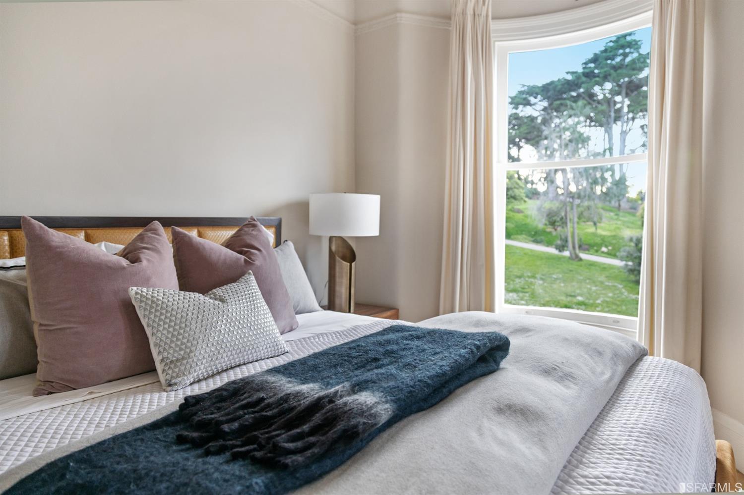 818 Steiner Street San Francisco, CA 94117 - Photo 24 of 74 Lower level is complete with a separate au pair or guest quarters that includes a bedroom/lounge and a full-bath which can be accessed separately though the home’s side entrance. Down the hall are a home gym & full-bathroom, a wine room, spacious laundry and utility areas, and a room with built-in storage that leads to the outdoor spa area with rain shower and cedar hot tub. There’s never been a better yard for entertaining; built-in seating, a roaring fire pit, and a concrete slide in its lower-level turf-lawn play space. This home offers a lifestyle surrounded by the beauty of Alamo Square Park, the vibrancy of Hayes Valley and Divisadero Corridor, and a clear connection to San Francisco’s downtown and beyond. 