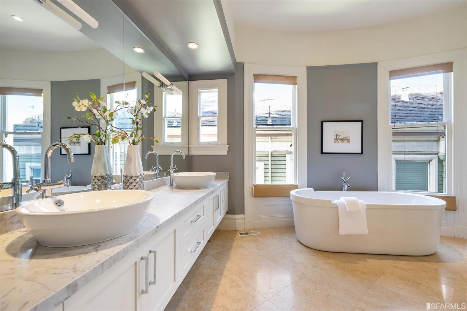 818 Steiner Street San Francisco, CA 94117 - Photo 25 of 74 Lower level is complete with a separate au pair or guest quarters that includes a bedroom/lounge and a full-bath which can be accessed separately though the home’s side entrance. Down the hall are a home gym & full-bathroom, a wine room, spacious laundry and utility areas, and a room with built-in storage that leads to the outdoor spa area with rain shower and cedar hot tub. There’s never been a better yard for entertaining; built-in seating, a roaring fire pit, and a concrete slide in its lower-level turf-lawn play space. This home offers a lifestyle surrounded by the beauty of Alamo Square Park, the vibrancy of Hayes Valley and Divisadero Corridor, and a clear connection to San Francisco’s downtown and beyond. 