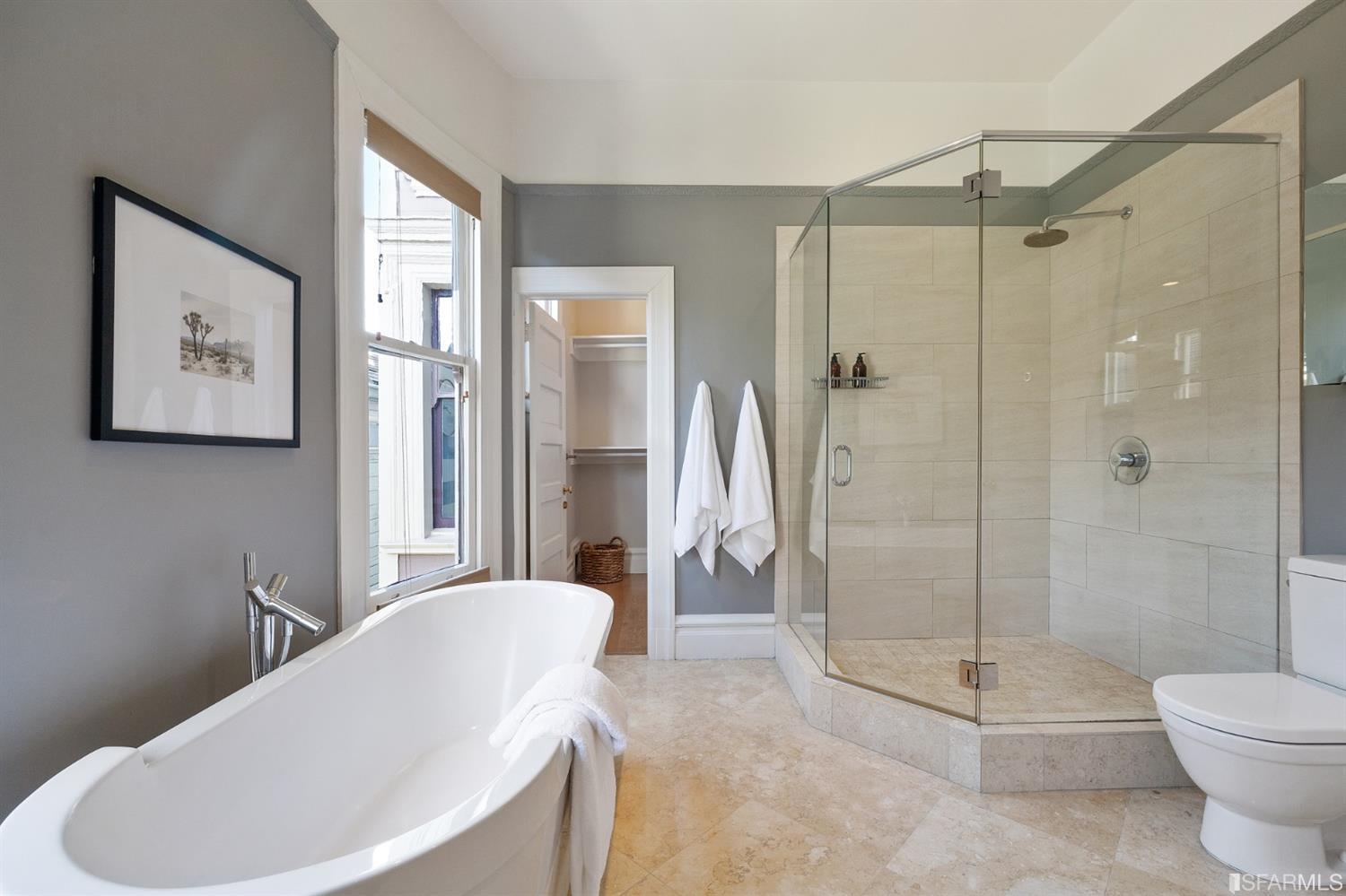 818 Steiner Street San Francisco, CA 94117 - Photo 26 of 74 Lower level is complete with a separate au pair or guest quarters that includes a bedroom/lounge and a full-bath which can be accessed separately though the home’s side entrance. Down the hall are a home gym & full-bathroom, a wine room, spacious laundry and utility areas, and a room with built-in storage that leads to the outdoor spa area with rain shower and cedar hot tub. There’s never been a better yard for entertaining; built-in seating, a roaring fire pit, and a concrete slide in its lower-level turf-lawn play space. This home offers a lifestyle surrounded by the beauty of Alamo Square Park, the vibrancy of Hayes Valley and Divisadero Corridor, and a clear connection to San Francisco’s downtown and beyond. 