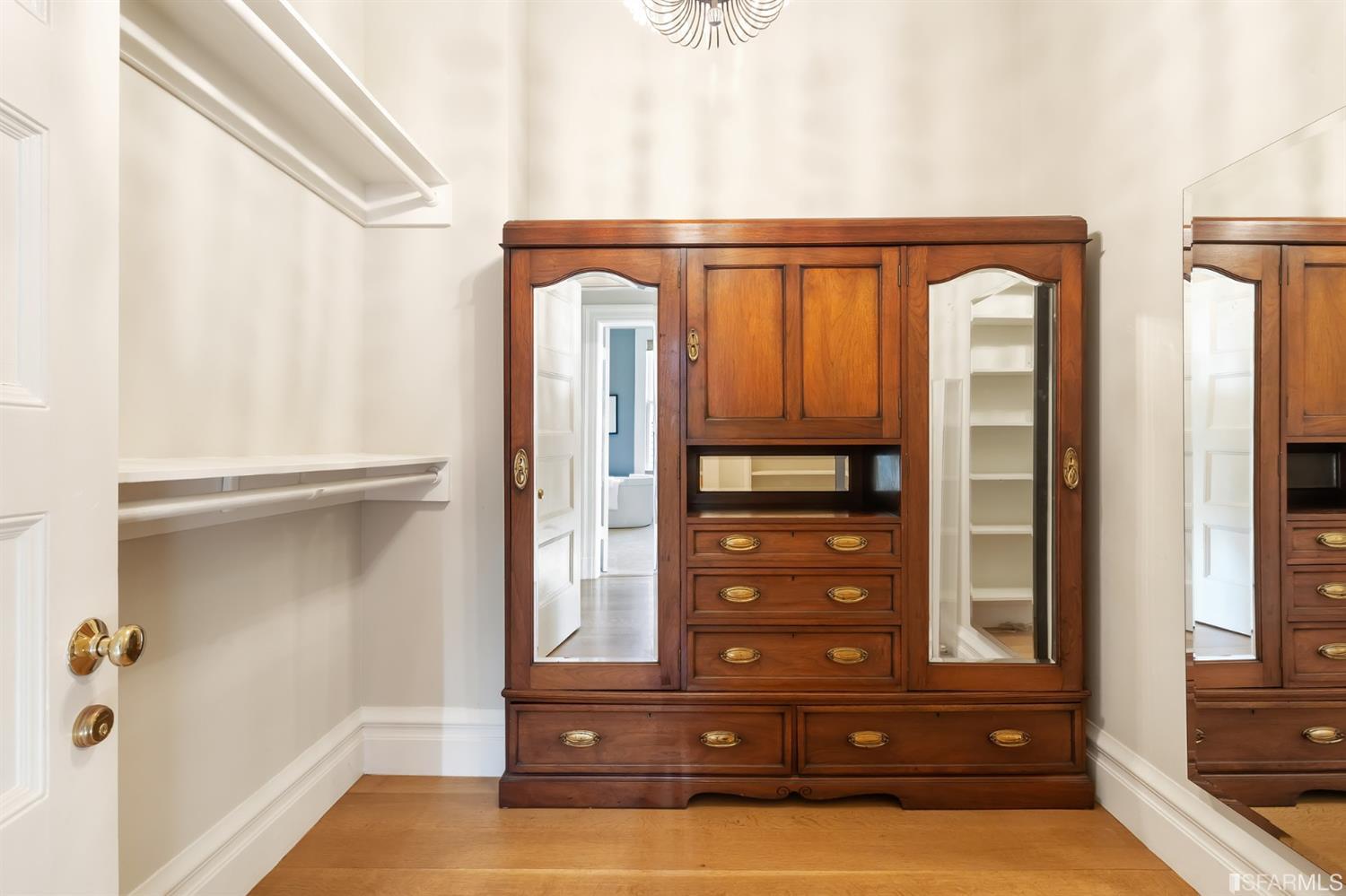 818 Steiner Street San Francisco, CA 94117 - Photo 28 of 74 Lower level is complete with a separate au pair or guest quarters that includes a bedroom/lounge and a full-bath which can be accessed separately though the home’s side entrance. Down the hall are a home gym & full-bathroom, a wine room, spacious laundry and utility areas, and a room with built-in storage that leads to the outdoor spa area with rain shower and cedar hot tub. There’s never been a better yard for entertaining; built-in seating, a roaring fire pit, and a concrete slide in its lower-level turf-lawn play space. This home offers a lifestyle surrounded by the beauty of Alamo Square Park, the vibrancy of Hayes Valley and Divisadero Corridor, and a clear connection to San Francisco’s downtown and beyond. 