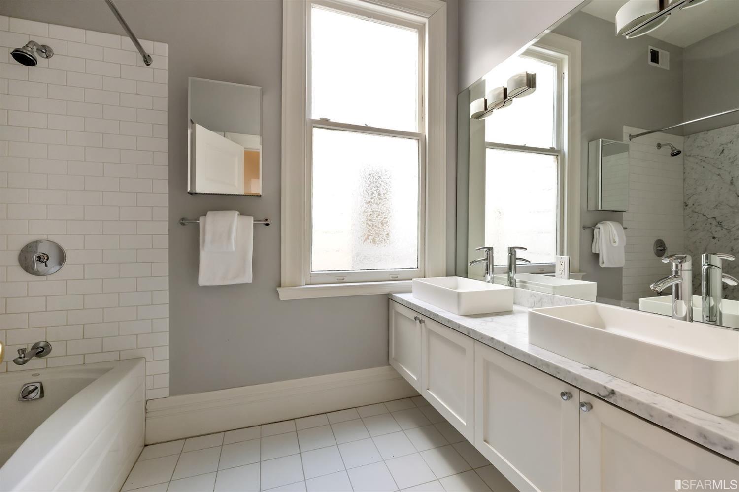 818 Steiner Street San Francisco, CA 94117 - Photo 29 of 74 Lower level is complete with a separate au pair or guest quarters that includes a bedroom/lounge and a full-bath which can be accessed separately though the home’s side entrance. Down the hall are a home gym & full-bathroom, a wine room, spacious laundry and utility areas, and a room with built-in storage that leads to the outdoor spa area with rain shower and cedar hot tub. There’s never been a better yard for entertaining; built-in seating, a roaring fire pit, and a concrete slide in its lower-level turf-lawn play space. This home offers a lifestyle surrounded by the beauty of Alamo Square Park, the vibrancy of Hayes Valley and Divisadero Corridor, and a clear connection to San Francisco’s downtown and beyond. 