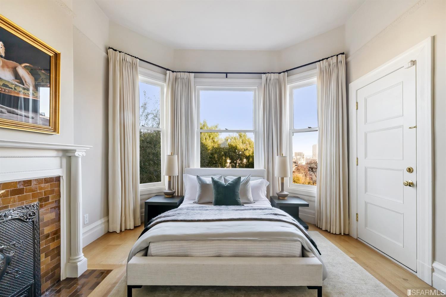 818 Steiner Street San Francisco, CA 94117 - Photo 32 of 74 Lower level is complete with a separate au pair or guest quarters that includes a bedroom/lounge and a full-bath which can be accessed separately though the home’s side entrance. Down the hall are a home gym & full-bathroom, a wine room, spacious laundry and utility areas, and a room with built-in storage that leads to the outdoor spa area with rain shower and cedar hot tub. There’s never been a better yard for entertaining; built-in seating, a roaring fire pit, and a concrete slide in its lower-level turf-lawn play space. This home offers a lifestyle surrounded by the beauty of Alamo Square Park, the vibrancy of Hayes Valley and Divisadero Corridor, and a clear connection to San Francisco’s downtown and beyond. 