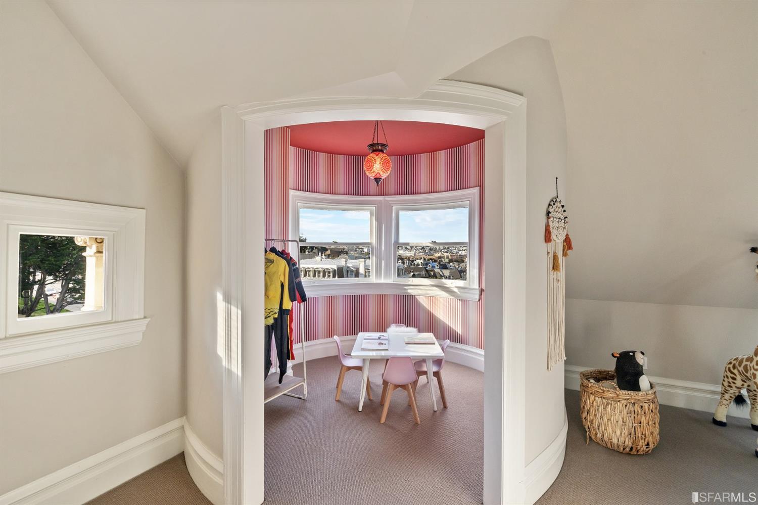 818 Steiner Street San Francisco, CA 94117 - Photo 36 of 74 Lower level is complete with a separate au pair or guest quarters that includes a bedroom/lounge and a full-bath which can be accessed separately though the home’s side entrance. Down the hall are a home gym & full-bathroom, a wine room, spacious laundry and utility areas, and a room with built-in storage that leads to the outdoor spa area with rain shower and cedar hot tub. There’s never been a better yard for entertaining; built-in seating, a roaring fire pit, and a concrete slide in its lower-level turf-lawn play space. This home offers a lifestyle surrounded by the beauty of Alamo Square Park, the vibrancy of Hayes Valley and Divisadero Corridor, and a clear connection to San Francisco’s downtown and beyond. 