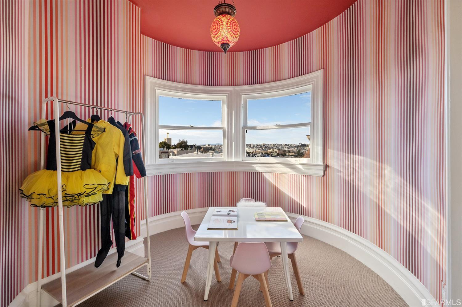 818 Steiner Street San Francisco, CA 94117 - Photo 37 of 74 Lower level is complete with a separate au pair or guest quarters that includes a bedroom/lounge and a full-bath which can be accessed separately though the home’s side entrance. Down the hall are a home gym & full-bathroom, a wine room, spacious laundry and utility areas, and a room with built-in storage that leads to the outdoor spa area with rain shower and cedar hot tub. There’s never been a better yard for entertaining; built-in seating, a roaring fire pit, and a concrete slide in its lower-level turf-lawn play space. This home offers a lifestyle surrounded by the beauty of Alamo Square Park, the vibrancy of Hayes Valley and Divisadero Corridor, and a clear connection to San Francisco’s downtown and beyond. 