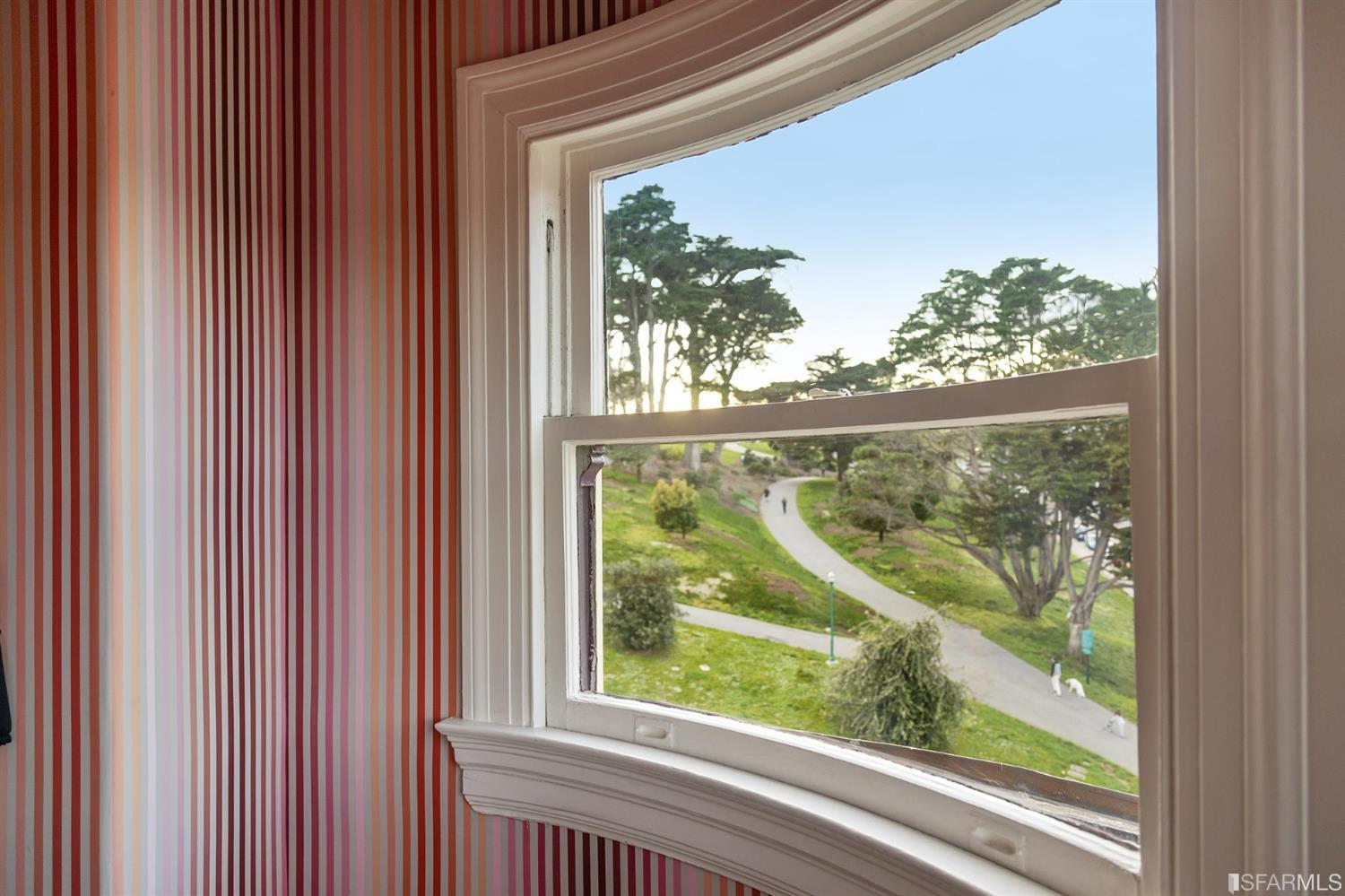 818 Steiner Street San Francisco, CA 94117 - Photo 38 of 74 Lower level is complete with a separate au pair or guest quarters that includes a bedroom/lounge and a full-bath which can be accessed separately though the home’s side entrance. Down the hall are a home gym & full-bathroom, a wine room, spacious laundry and utility areas, and a room with built-in storage that leads to the outdoor spa area with rain shower and cedar hot tub. There’s never been a better yard for entertaining; built-in seating, a roaring fire pit, and a concrete slide in its lower-level turf-lawn play space. This home offers a lifestyle surrounded by the beauty of Alamo Square Park, the vibrancy of Hayes Valley and Divisadero Corridor, and a clear connection to San Francisco’s downtown and beyond. 