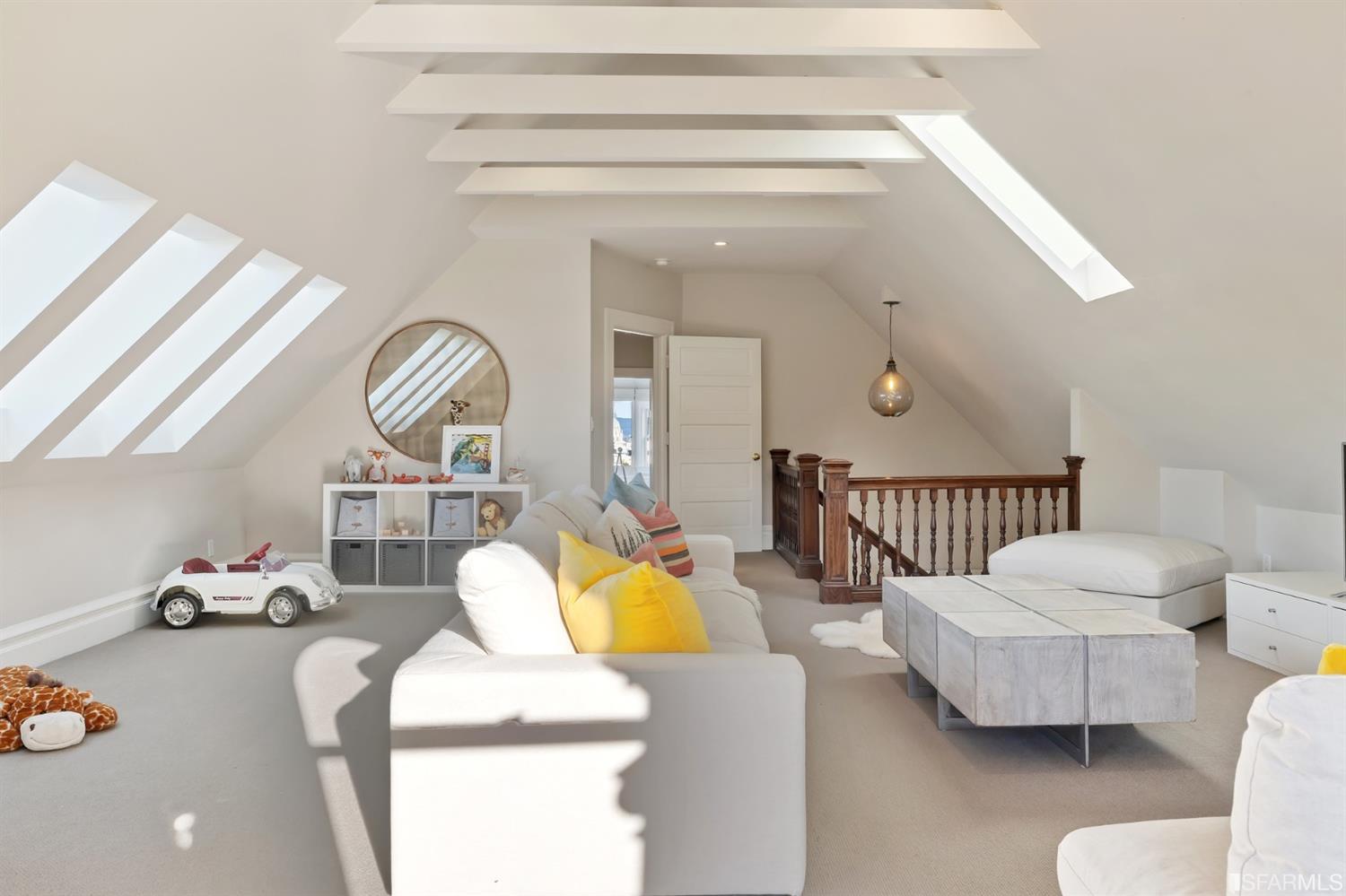 818 Steiner Street San Francisco, CA 94117 - Photo 40 of 74 Lower level is complete with a separate au pair or guest quarters that includes a bedroom/lounge and a full-bath which can be accessed separately though the home’s side entrance. Down the hall are a home gym & full-bathroom, a wine room, spacious laundry and utility areas, and a room with built-in storage that leads to the outdoor spa area with rain shower and cedar hot tub. There’s never been a better yard for entertaining; built-in seating, a roaring fire pit, and a concrete slide in its lower-level turf-lawn play space. This home offers a lifestyle surrounded by the beauty of Alamo Square Park, the vibrancy of Hayes Valley and Divisadero Corridor, and a clear connection to San Francisco’s downtown and beyond. 