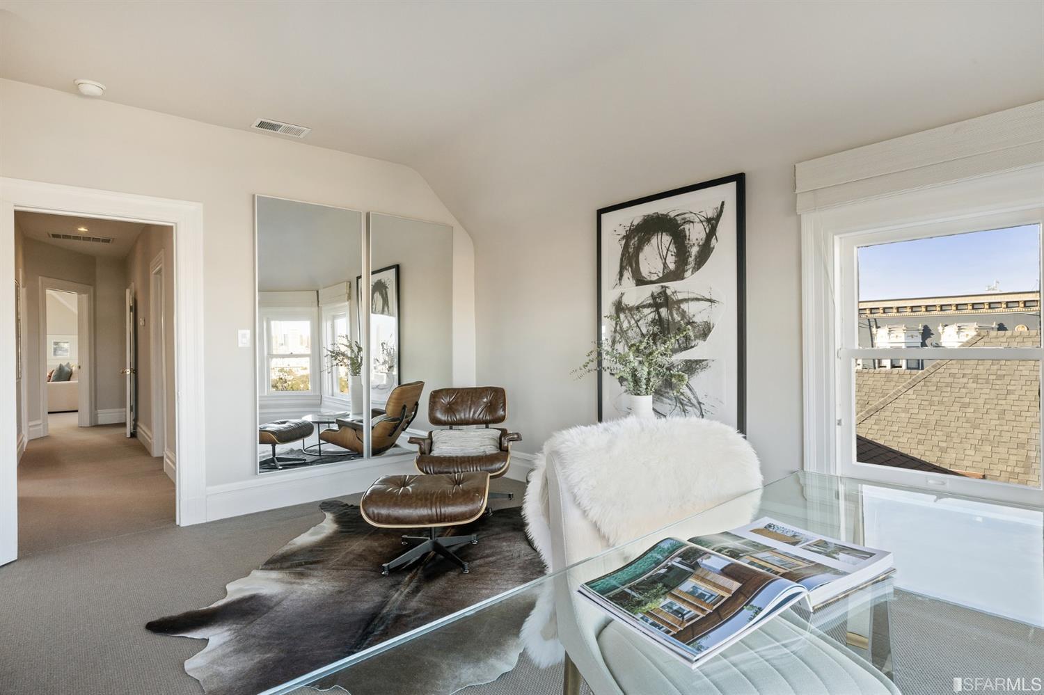 818 Steiner Street San Francisco, CA 94117 - Photo 46 of 74 Lower level is complete with a separate au pair or guest quarters that includes a bedroom/lounge and a full-bath which can be accessed separately though the home’s side entrance. Down the hall are a home gym & full-bathroom, a wine room, spacious laundry and utility areas, and a room with built-in storage that leads to the outdoor spa area with rain shower and cedar hot tub. There’s never been a better yard for entertaining; built-in seating, a roaring fire pit, and a concrete slide in its lower-level turf-lawn play space. This home offers a lifestyle surrounded by the beauty of Alamo Square Park, the vibrancy of Hayes Valley and Divisadero Corridor, and a clear connection to San Francisco’s downtown and beyond. 