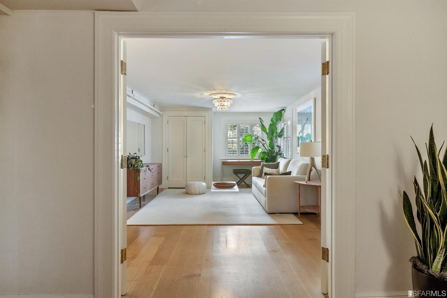 818 Steiner Street San Francisco, CA 94117 - Photo 50 of 74 Lower level is complete with a separate au pair or guest quarters that includes a bedroom/lounge and a full-bath which can be accessed separately though the home’s side entrance. Down the hall are a home gym & full-bathroom, a wine room, spacious laundry and utility areas, and a room with built-in storage that leads to the outdoor spa area with rain shower and cedar hot tub. There’s never been a better yard for entertaining; built-in seating, a roaring fire pit, and a concrete slide in its lower-level turf-lawn play space. This home offers a lifestyle surrounded by the beauty of Alamo Square Park, the vibrancy of Hayes Valley and Divisadero Corridor, and a clear connection to San Francisco’s downtown and beyond. 