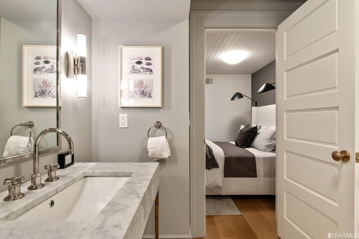 818 Steiner Street San Francisco, CA 94117 - Photo 54 of 74 Lower level is complete with a separate au pair or guest quarters that includes a bedroom/lounge and a full-bath which can be accessed separately though the home’s side entrance. Down the hall are a home gym & full-bathroom, a wine room, spacious laundry and utility areas, and a room with built-in storage that leads to the outdoor spa area with rain shower and cedar hot tub. There’s never been a better yard for entertaining; built-in seating, a roaring fire pit, and a concrete slide in its lower-level turf-lawn play space. This home offers a lifestyle surrounded by the beauty of Alamo Square Park, the vibrancy of Hayes Valley and Divisadero Corridor, and a clear connection to San Francisco’s downtown and beyond. 