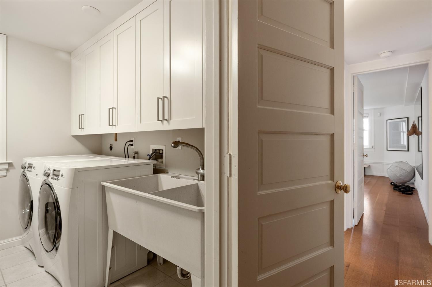 818 Steiner Street San Francisco, CA 94117 - Photo 55 of 74 Lower level is complete with a separate au pair or guest quarters that includes a bedroom/lounge and a full-bath which can be accessed separately though the home’s side entrance. Down the hall are a home gym & full-bathroom, a wine room, spacious laundry and utility areas, and a room with built-in storage that leads to the outdoor spa area with rain shower and cedar hot tub. There’s never been a better yard for entertaining; built-in seating, a roaring fire pit, and a concrete slide in its lower-level turf-lawn play space. This home offers a lifestyle surrounded by the beauty of Alamo Square Park, the vibrancy of Hayes Valley and Divisadero Corridor, and a clear connection to San Francisco’s downtown and beyond. 