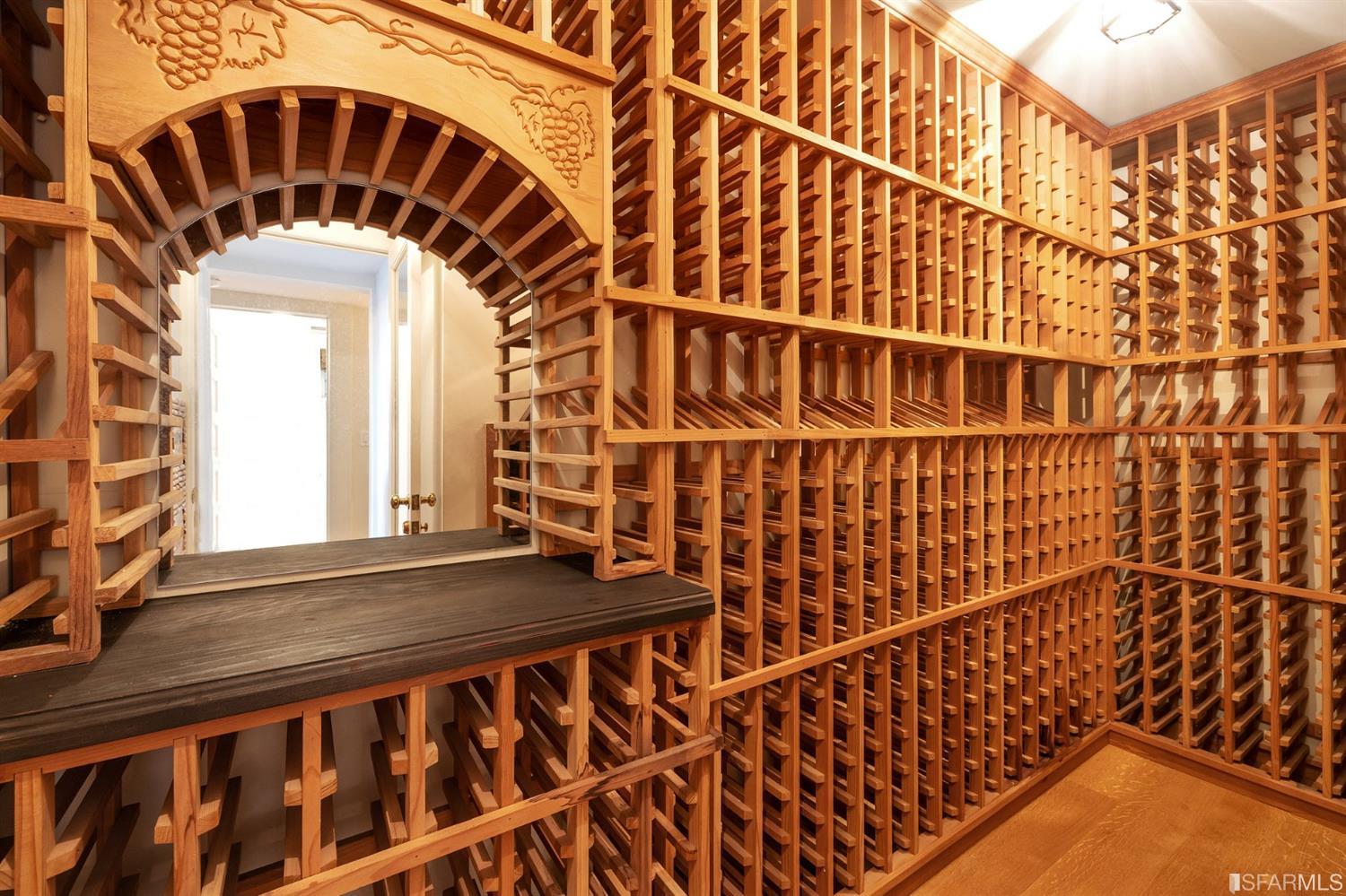 818 Steiner Street San Francisco, CA 94117 - Photo 58 of 74 Lower level is complete with a separate au pair or guest quarters that includes a bedroom/lounge and a full-bath which can be accessed separately though the home’s side entrance. Down the hall are a home gym & full-bathroom, a wine room, spacious laundry and utility areas, and a room with built-in storage that leads to the outdoor spa area with rain shower and cedar hot tub. There’s never been a better yard for entertaining; built-in seating, a roaring fire pit, and a concrete slide in its lower-level turf-lawn play space. This home offers a lifestyle surrounded by the beauty of Alamo Square Park, the vibrancy of Hayes Valley and Divisadero Corridor, and a clear connection to San Francisco’s downtown and beyond. 