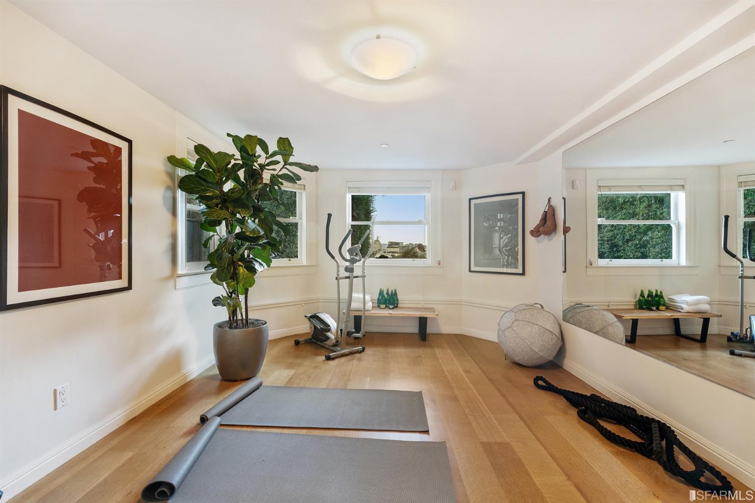 818 Steiner Street San Francisco, CA 94117 - Photo 59 of 74 Lower level is complete with a separate au pair or guest quarters that includes a bedroom/lounge and a full-bath which can be accessed separately though the home’s side entrance. Down the hall are a home gym & full-bathroom, a wine room, spacious laundry and utility areas, and a room with built-in storage that leads to the outdoor spa area with rain shower and cedar hot tub. There’s never been a better yard for entertaining; built-in seating, a roaring fire pit, and a concrete slide in its lower-level turf-lawn play space. This home offers a lifestyle surrounded by the beauty of Alamo Square Park, the vibrancy of Hayes Valley and Divisadero Corridor, and a clear connection to San Francisco’s downtown and beyond. 