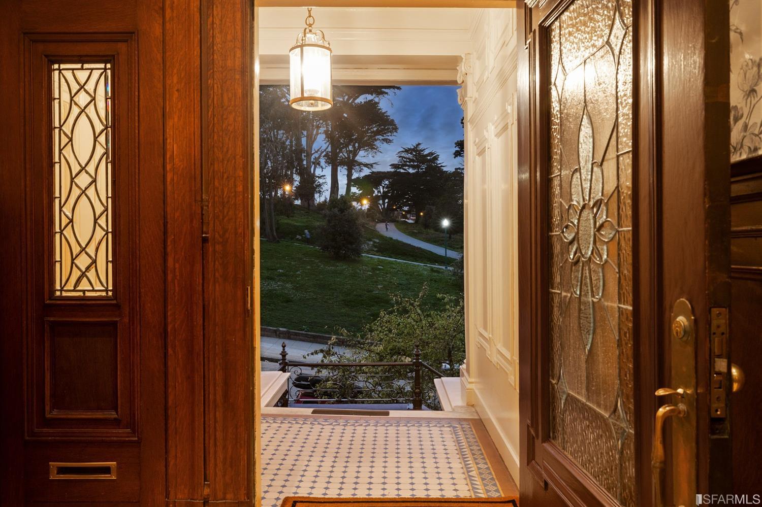 818 Steiner Street San Francisco, CA 94117 - Photo 62 of 74 Lower level is complete with a separate au pair or guest quarters that includes a bedroom/lounge and a full-bath which can be accessed separately though the home's side entrance. Down the hall are a home gym & full-bathroom, a wine room, spacious laundry and utility areas, and a room with built-in storage that leads to the outdoor spa area with rain shower and cedar hot tub. There's never been a better yard for entertaining; built-in seating, a roaring fire pit, and a concrete slide in its lower-level turf-lawn play space. This home offers a lifestyle surrounded by the beauty of Alamo Square Park, the vibrancy of Hayes Valley and Divisadero Corridor, and a clear connection to San Francisco's downtown and beyond.