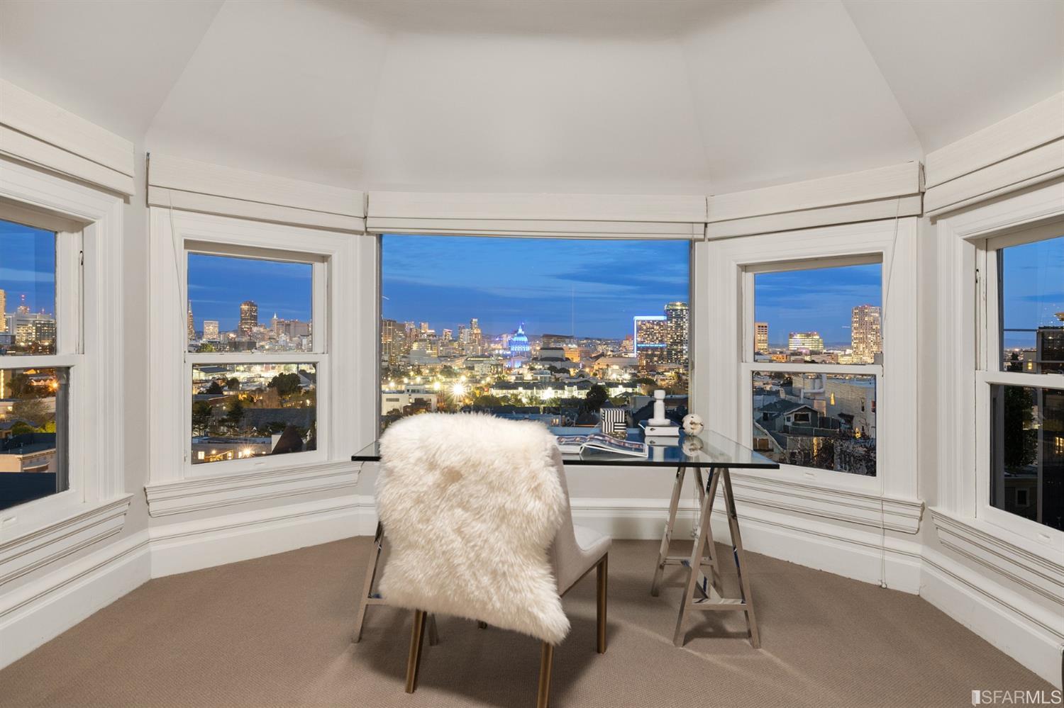 818 Steiner Street San Francisco, CA 94117 - Photo 69 of 74 Lower level is complete with a separate au pair or guest quarters that includes a bedroom/lounge and a full-bath which can be accessed separately though the home's side entrance. Down the hall are a home gym & full-bathroom, a wine room, spacious laundry and utility areas, and a room with built-in storage that leads to the outdoor spa area with rain shower and cedar hot tub. There's never been a better yard for entertaining; built-in seating, a roaring fire pit, and a concrete slide in its lower-level turf-lawn play space. This home offers a lifestyle surrounded by the beauty of Alamo Square Park, the vibrancy of Hayes Valley and Divisadero Corridor, and a clear connection to San Francisco's downtown and beyond.