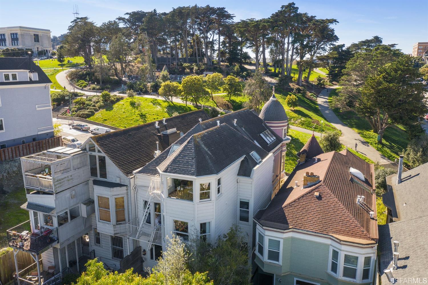 818 Steiner Street San Francisco, CA 94117 - Photo 71 of 74 Lower level is complete with a separate au pair or guest quarters that includes a bedroom/lounge and a full-bath which can be accessed separately though the home's side entrance. Down the hall are a home gym & full-bathroom, a wine room, spacious laundry and utility areas, and a room with built-in storage that leads to the outdoor spa area with rain shower and cedar hot tub. There's never been a better yard for entertaining; built-in seating, a roaring fire pit, and a concrete slide in its lower-level turf-lawn play space. This home offers a lifestyle surrounded by the beauty of Alamo Square Park, the vibrancy of Hayes Valley and Divisadero Corridor, and a clear connection to San Francisco's downtown and beyond.
