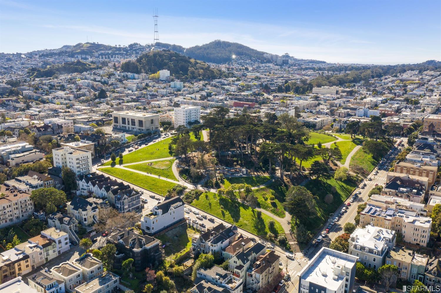 818 Steiner Street San Francisco, CA 94117 - Photo 72 of 74 Lower level is complete with a separate au pair or guest quarters that includes a bedroom/lounge and a full-bath which can be accessed separately though the home's side entrance. Down the hall are a home gym & full-bathroom, a wine room, spacious laundry and utility areas, and a room with built-in storage that leads to the outdoor spa area with rain shower and cedar hot tub. There's never been a better yard for entertaining; built-in seating, a roaring fire pit, and a concrete slide in its lower-level turf-lawn play space. This home offers a lifestyle surrounded by the beauty of Alamo Square Park, the vibrancy of Hayes Valley and Divisadero Corridor, and a clear connection to San Francisco's downtown and beyond.