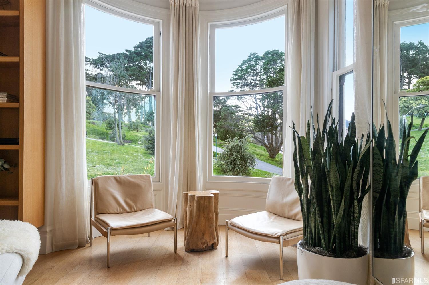 818 Steiner Street San Francisco, CA 94117 - Photo 10 of 74 Lower level is complete with a separate au pair or guest quarters that includes a bedroom/lounge and a full-bath which can be accessed separately though the home’s side entrance. Down the hall are a home gym & full-bathroom, a wine room, spacious laundry and utility areas, and a room with built-in storage that leads to the outdoor spa area with rain shower and cedar hot tub. There’s never been a better yard for entertaining; built-in seating, a roaring fire pit, and a concrete slide in its lower-level turf-lawn play space. This home offers a lifestyle surrounded by the beauty of Alamo Square Park, the vibrancy of Hayes Valley and Divisadero Corridor, and a clear connection to San Francisco’s downtown and beyond. 