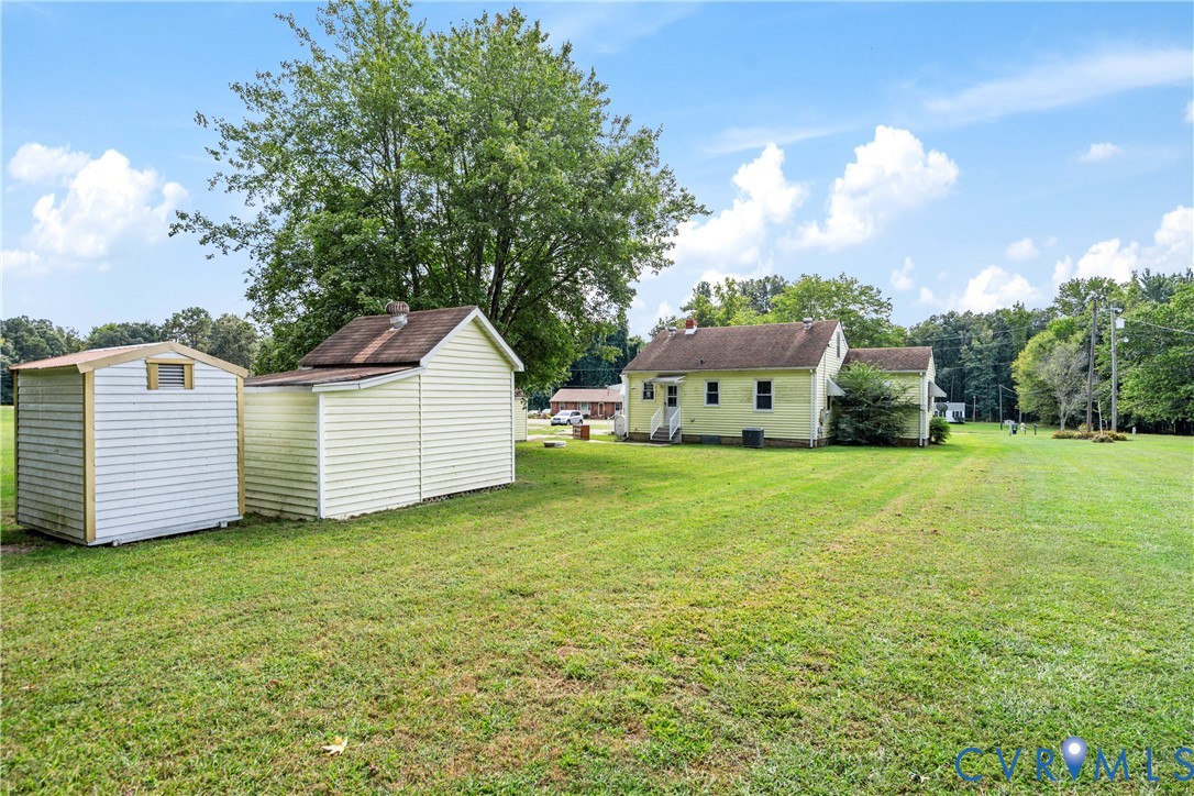 4000 Wayside Road Charles City, VA 23030 - Photo 22 of 30 Expansive green lawn with two detached storage she