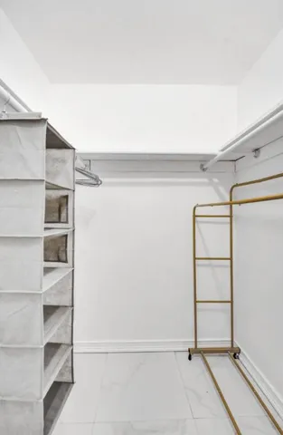 a view of an empty walk in closet