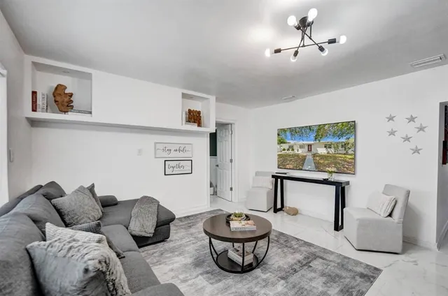 a living room with furniture and a couch