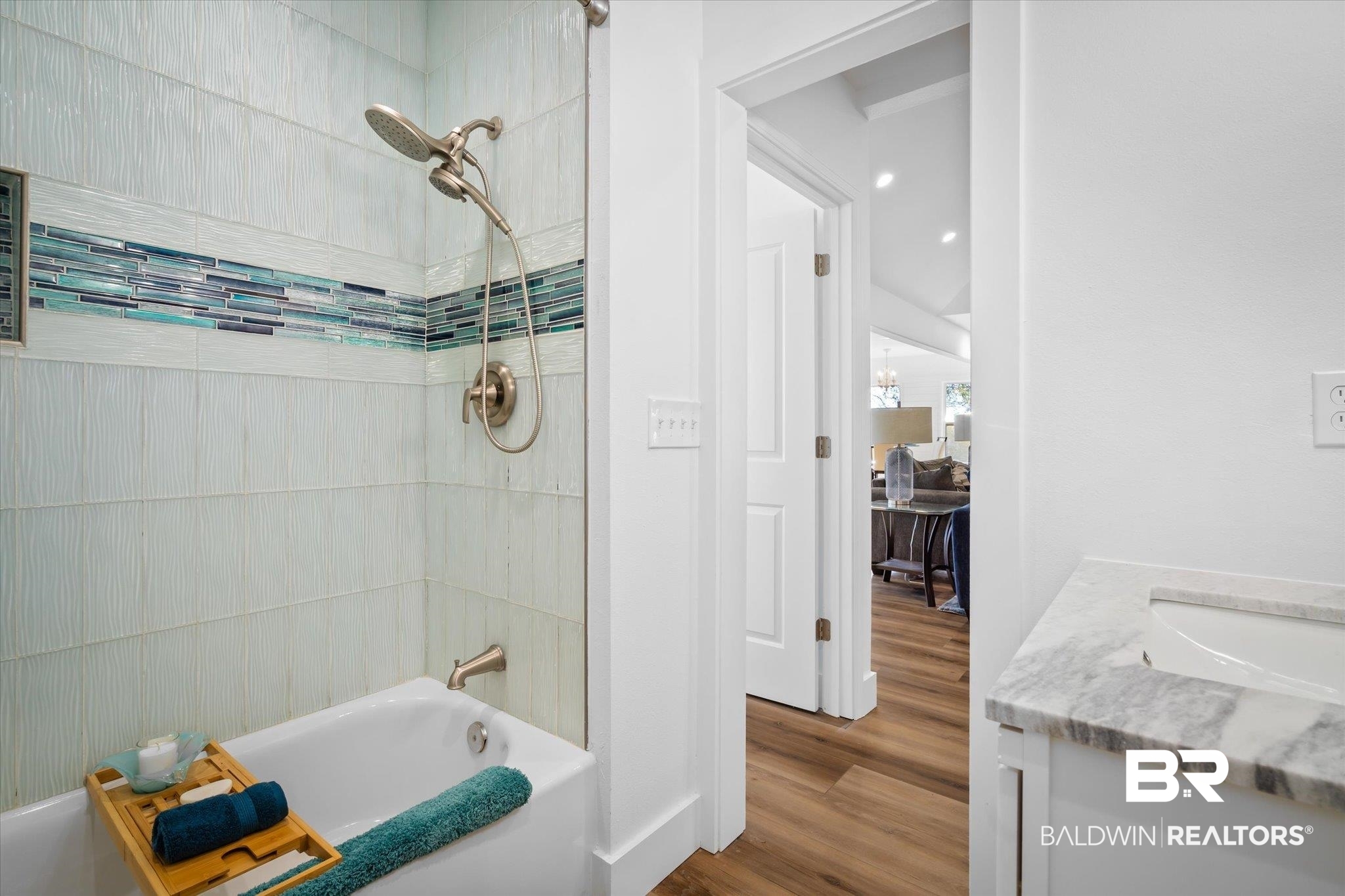 15111 Regus Road Coden, AL 36523 - Photo 17 of 35 Full bathroom with bathing tub / shower combination, vanity, and dark wood-style floors