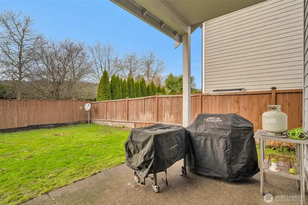 a view of a backyard with sitting area