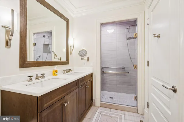 a bathroom with a shower sink and mirror