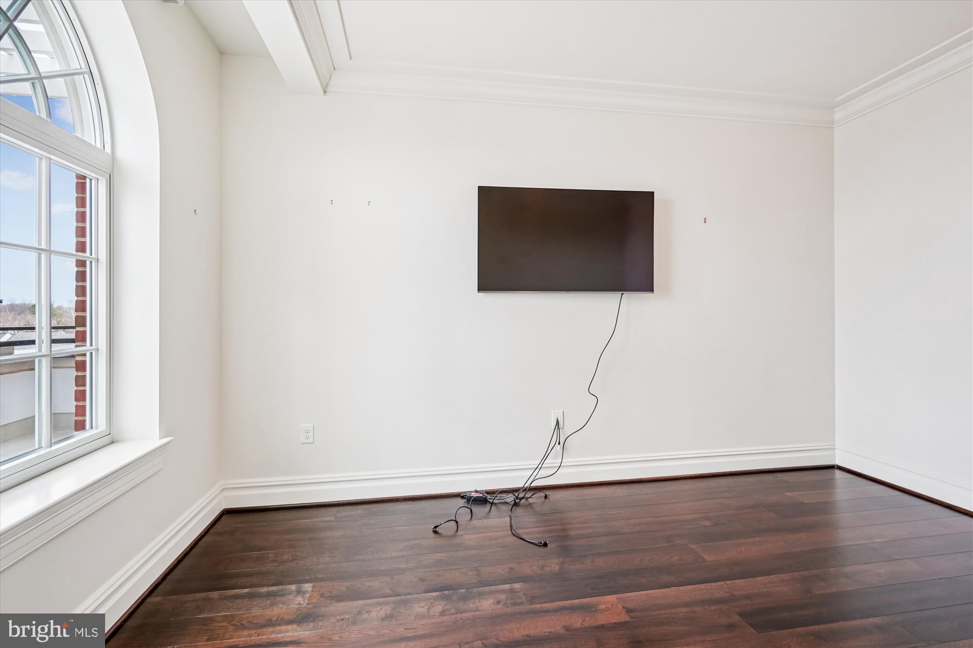 6900 Fleetwood Road, Unit 600 McLean, VA 22101 - Photo 16 of 31 a room with a floor and a flat screen tv