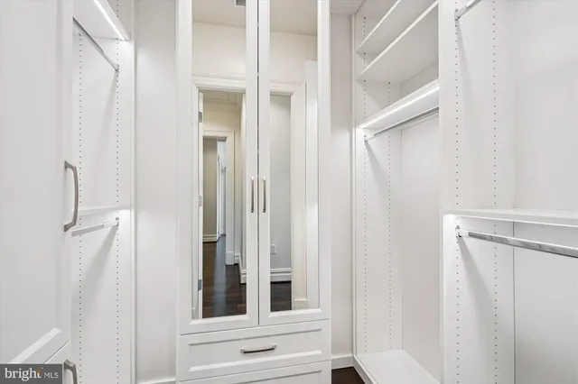 a view of a bathroom from a corridor