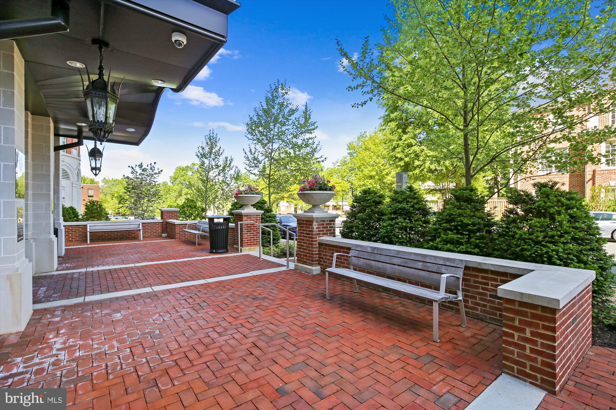 6900 Fleetwood Road, Unit 600 McLean, VA 22101 - Photo 25 of 31 a view of a patio with a table and chairs and potted plants