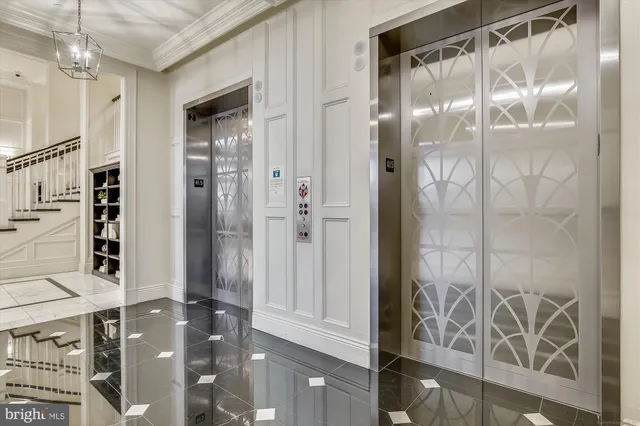 a view of an entryway with wooden floor