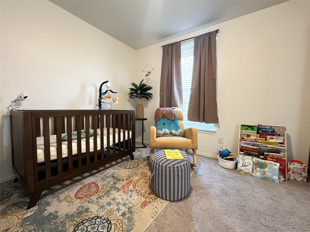 14313 James Buchanan Street Manor, TX 78653 - Photo 14 of 19 a bedroom with furniture and a window