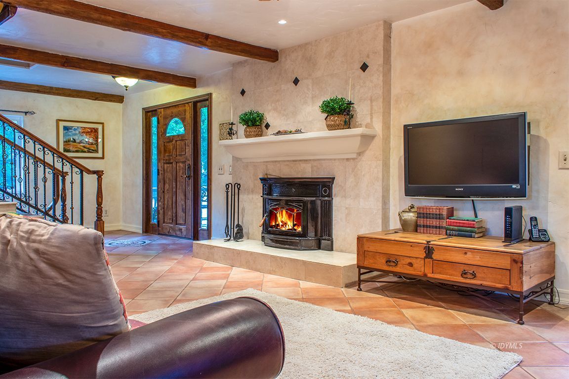 25341 Tahquitz Road Idyllwild, CA 92549 - Photo 12 of 56 a living room with furniture and a flat screen tv
