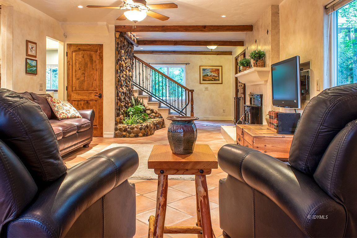 25341 Tahquitz Road Idyllwild, CA 92549 - Photo 14 of 56 a living room with furniture a large window and flat screen tv