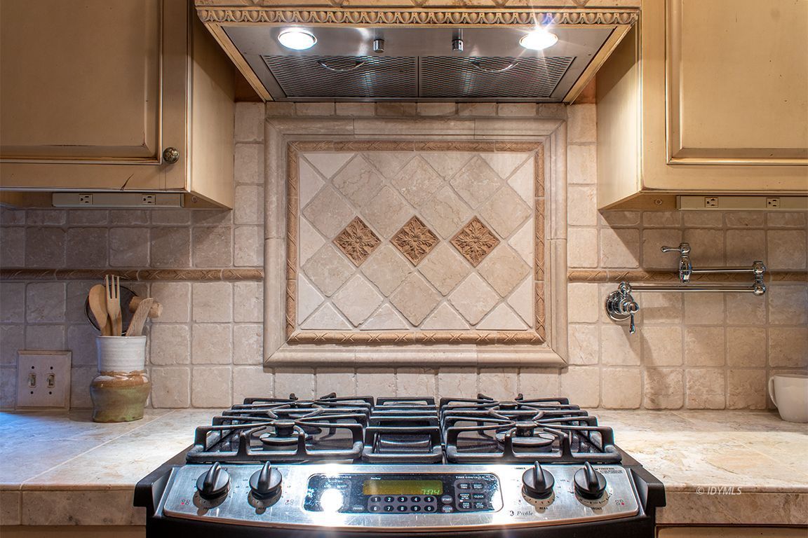 25341 Tahquitz Road Idyllwild, CA 92549 - Photo 20 of 56 a stove top oven sitting inside of a kitchen