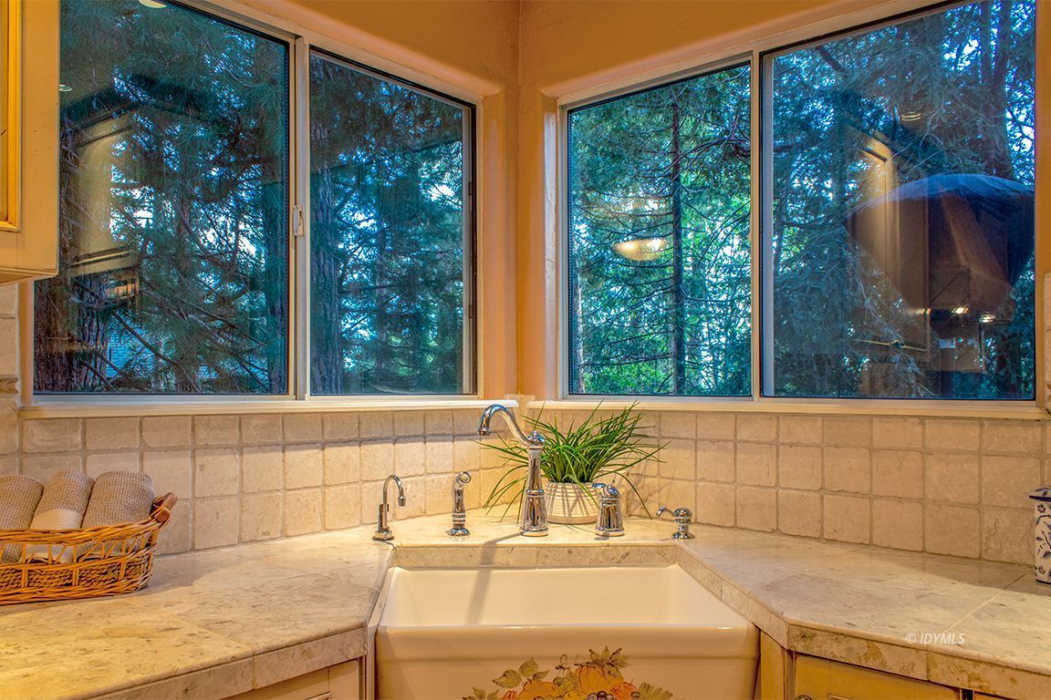 25341 Tahquitz Road Idyllwild, CA 92549 - Photo 21 of 56 a view of a sink and table in the kitchen