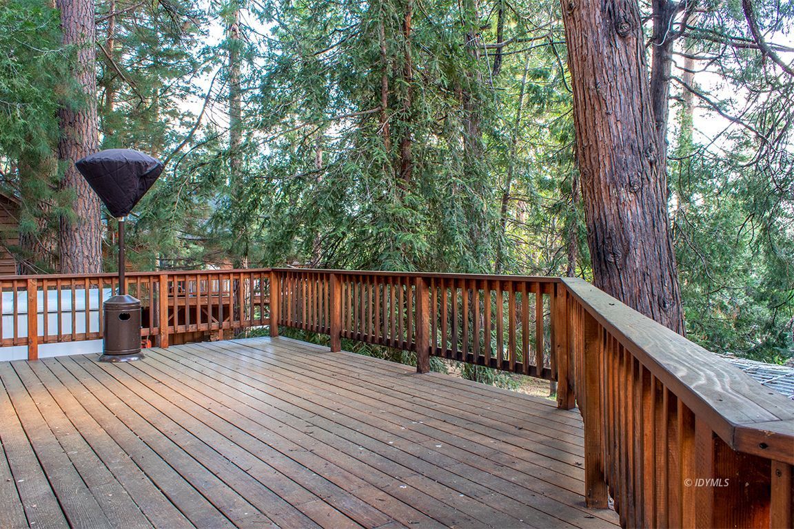 25341 Tahquitz Road Idyllwild, CA 92549 - Photo 28 of 56 a balcony with wooden floor and fence