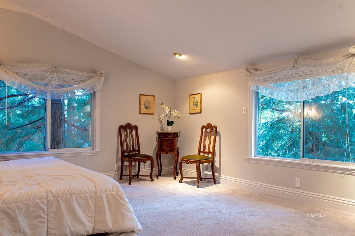 25341 Tahquitz Road Idyllwild, CA 92549 - Photo 32 of 56 a bed room with a bed and a chair