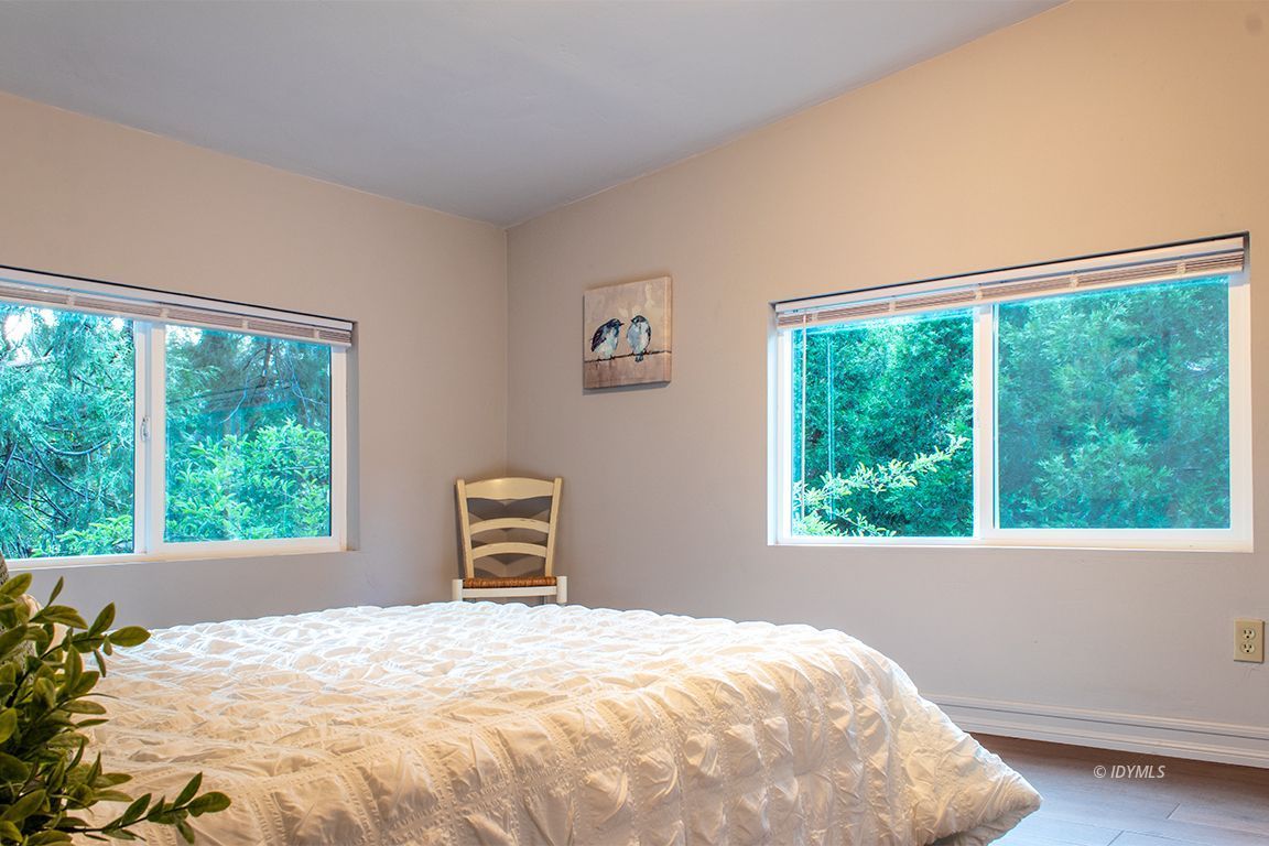25341 Tahquitz Road Idyllwild, CA 92549 - Photo 34 of 56 a bedroom with a bed and a window